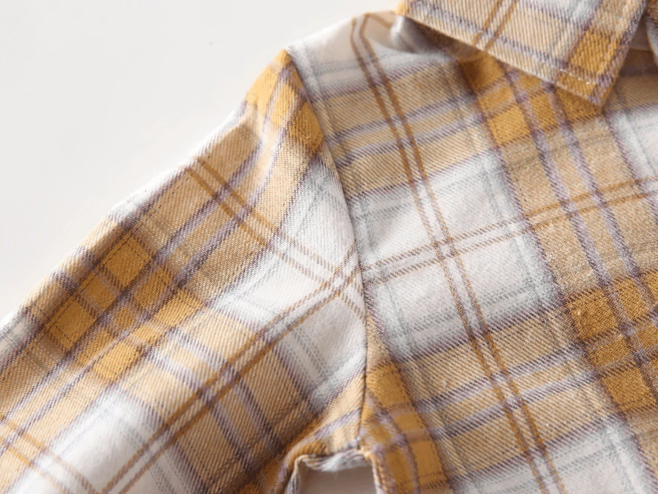 Close-up of Plaid Long-Sleeved Toddler Boys Flannel Shirt - SF3521 showcasing soft checked fabric and button details.
